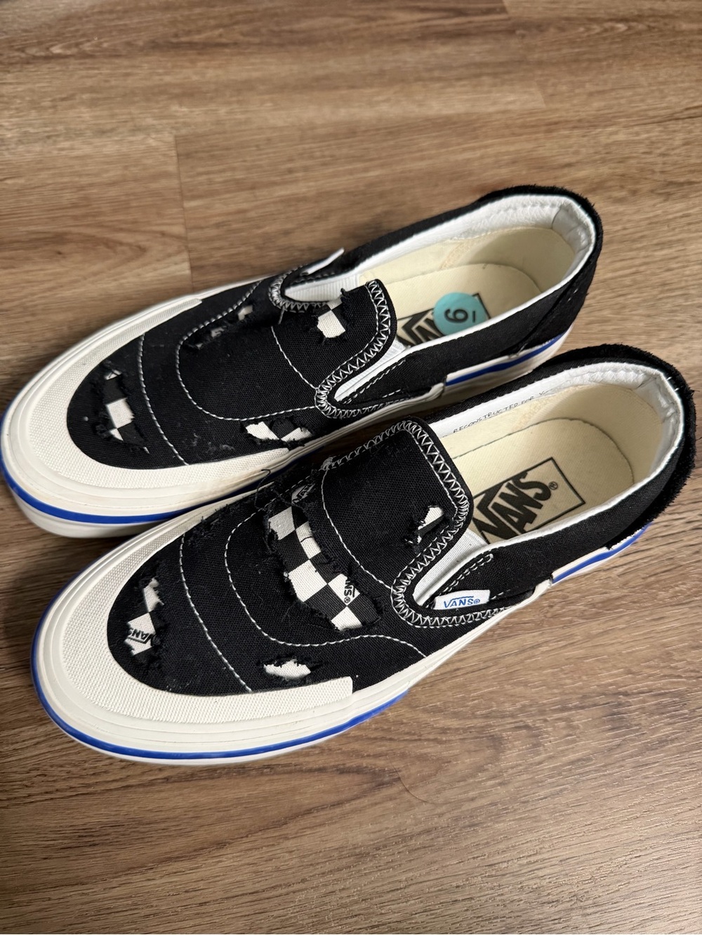 Vans Black Canvas Slip-On Sneakers with Blue Accent